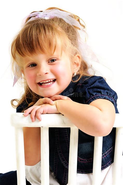 Pretty Blond Girl Sitting On A Chair Stock Photo Image Of Playful