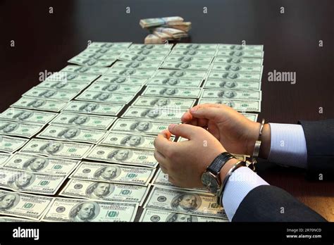 Bribe. Arrested for bribery. Caught red-handed Stock Photo - Alamy