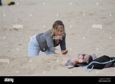 Woman Buried In Sand Beach Hi Res Stock Photography And Images Alamy