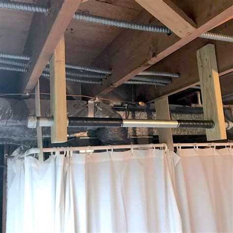 Sturdy, ceiling mounted pull up bar made from black pipe fittings from the hardware store. Simple DIY Basement Pull Up Bar | Family Handyman | The ...