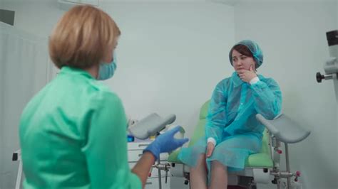 female conversing with her gynecologist during consultation by fotoliza
