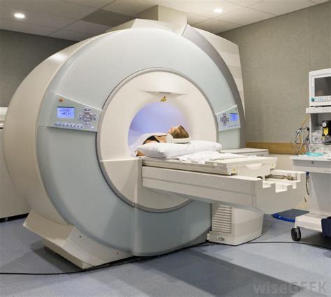 The person lies on a table that moves through a scanning ring, which looks like a large doughnut. What Does a CT Scan Technologist Do? (with pictures)