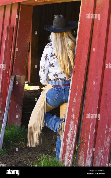 Cowgirl At A Barn Usa Oregon Stock Photo Alamy