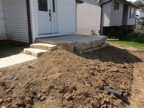 Armour Stone Retaining Wall And Steps With Pre Cast Patio Glencoe