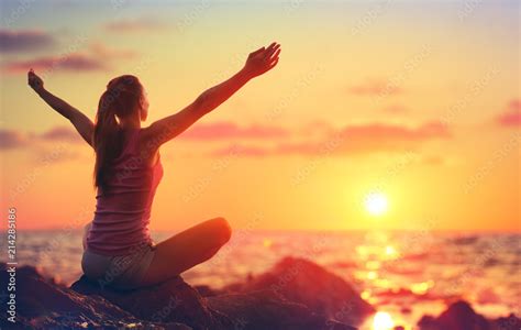 Relaxation And Yoga At Sunset Girl With Open Arms Looking Ocean Stock