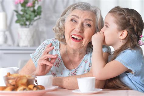Portrait Of Old Woman With A Young Girl Stock Image Image Of Home