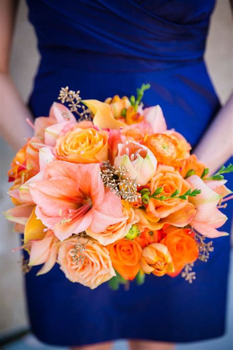 orange coral and gold wedding flowers with navy blue jcrew bridesmaid dresses amaryllis