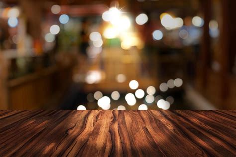 Top Desk With Blur Restaurant Backgroundwooden Table And Blurred Bokeh