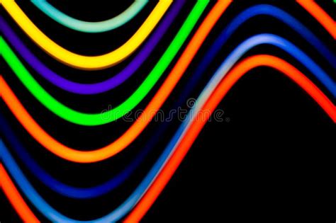 Luminous Multicolored Wavy Lines On A Black Background Stock