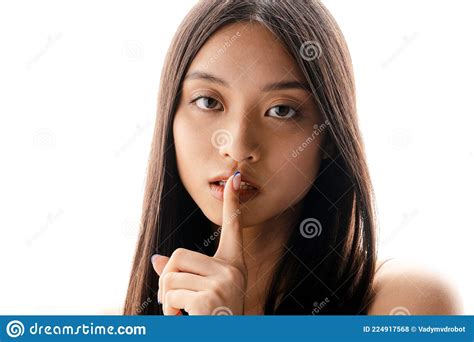 Young Asian Brunette Woman Looking And Showing Silence Gesture At