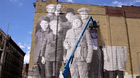 French Street Artist Unveils Massive Immigration Inspired Mural