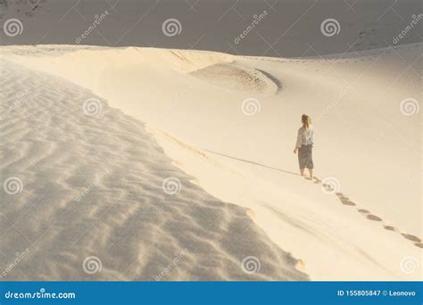 Female Silhouette Walking In Desert Sand Dunes Of Mui Ne Vietnam Stock Image Image Of Dunes