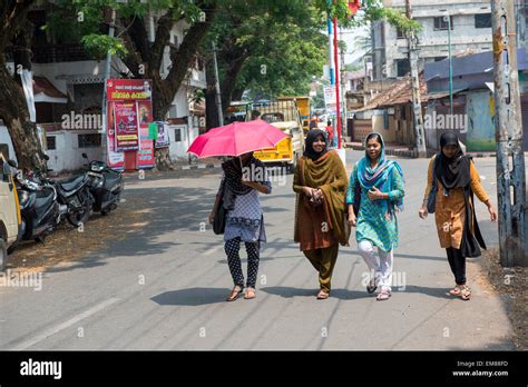 Four Young Indian Girls Walking Down A Road In Fort Kochi Kerala India