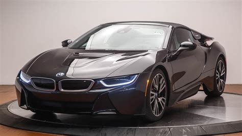 The signature features are wing doors that make entry and exit a challenge, the exotically low shape, and blue accents around the car, including blue seatbelts. New 2019 BMW i8 Roadster Convertible in Norwalk #B53507 ...