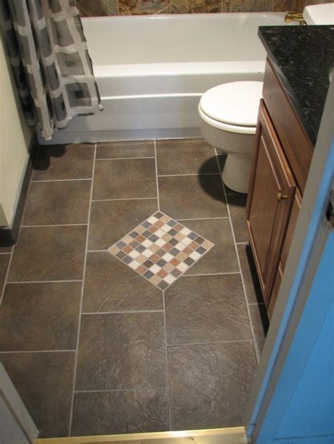 The mozaic tiles on one side of the wall and the covered shower space along with a modern bathroom design. Best Flooring for Bathroom that Enhance the Sophistication ...