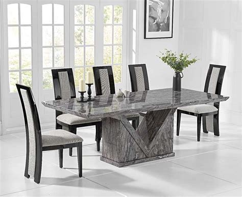 The tabletop and bench tops sport a natural wood grain finish while the legs of the pieces are a brushed gray color. Mocha 220cm Grey Marble Dining Table with Raphael Chairs | Marble top dining table, Dining room ...