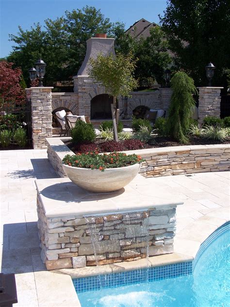 A Formal Pool With Waterfall And Planters Well I Guess Thatll Do
