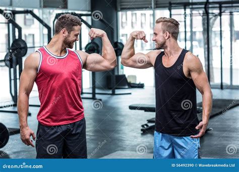 Two Smiling Muscular Men Flexing Biceps Stock Photo Image Of