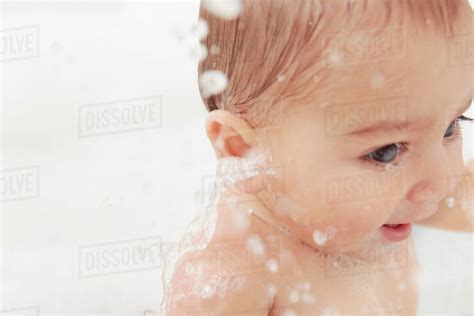 Baby Splashing In Bathtub Stock Photo Dissolve