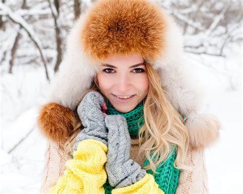 Beautiful Winter Portrait Of Young Woman In The Winter Snowy Scenery