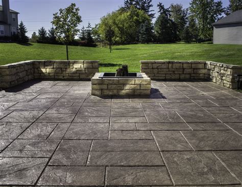 Spacious Outdoor Area using Stamped Concrete Patio with Square Stone ...