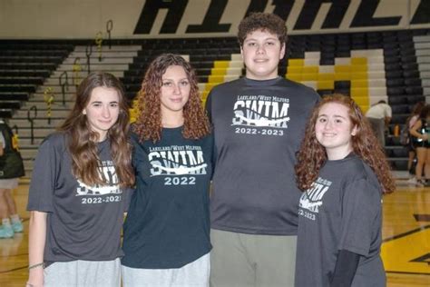 Swim Team Captains Improve Cheer On Others