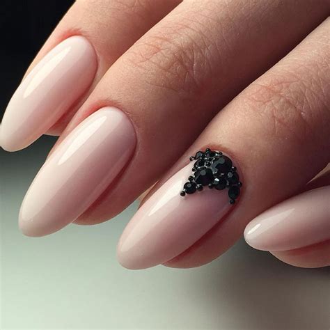 Purple and pink flowers in a female hand with red manicure. Lovely Nail Designs with Light Pink Polish - Fashion 2D