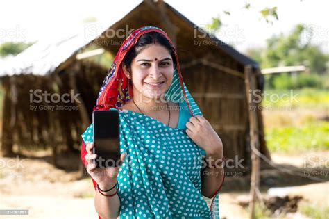 Indian Woman Showing Mobile Phone Stock Photo Download Image Now