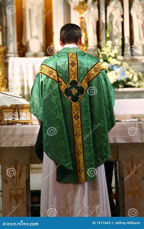 Catholic Priest Facing Altar Royalty Free Stock Photography