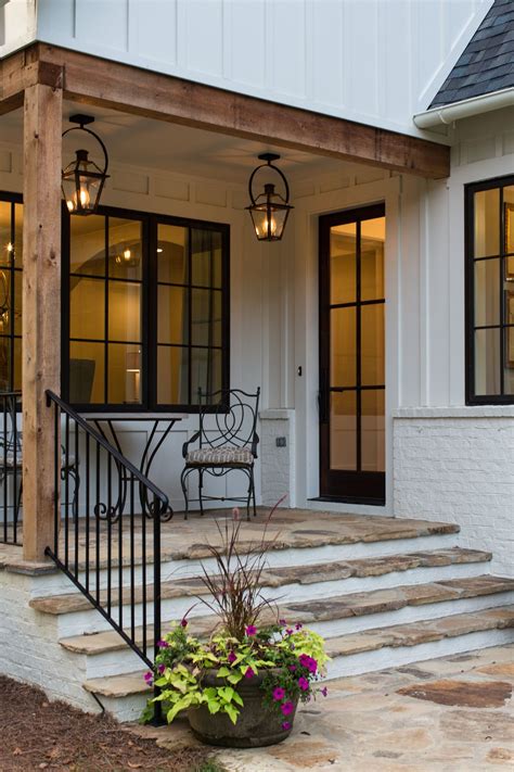 The converging lines add dimension to the whitewashed wall without overwhelming it. Modern farmhouse exterior, Farmhouse exterior, Porch design