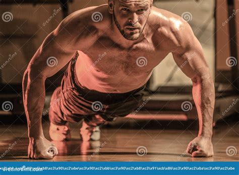 Man Doing Push Ups Muscular And Strong Guy Exercising Slim Man Doing