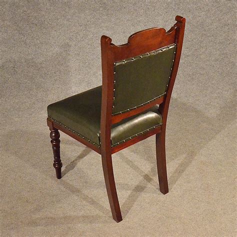They have 'slight' wing backs with curved arms and a loose feather filled cushion. Antique Leather Upholstered Dining Chairs Quality ...