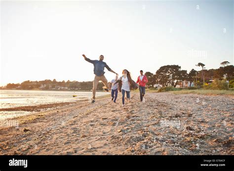 Group Of Friends Having Fun On Beach Stock Photo Alamy