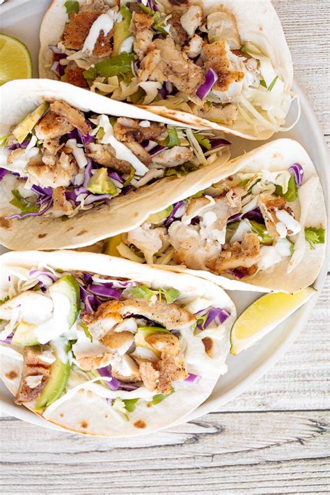 I said i was getting my buns back in the kitchen this grilled chili lime fish tacos with sour cream cabbage slaw, mango, and avocado. Easy Fish Tacos with Lime Crema | Recipe in 2020 | Fish ...