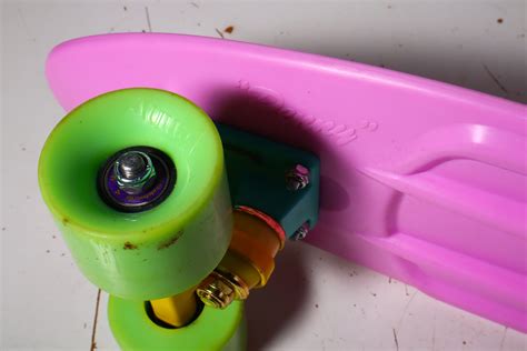 This 32 inch penny board is a crossbreed of a cruiser and traditional skateboard. Penny Board Skateboard - Pink with Pastel Yellow/Blue ...