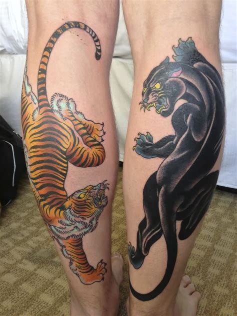 traditional panther and tiger tattoo on both leg calf calf tattoo foot tattoos leg tattoos