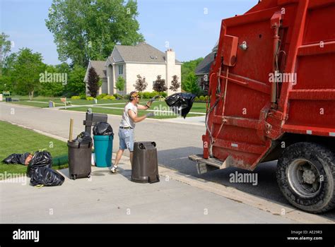 Residential Trash Collection Crew Pick Up Waste Products Stock Photo