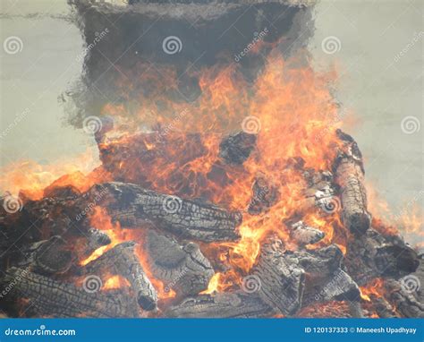 Funeral Pyre with Fire Wood and Flames at Cremation Grounds Stock Image