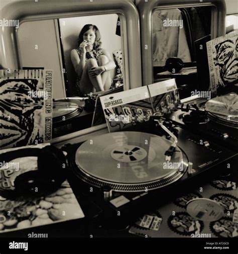 A Girl Sitting In Her Room Listening To Records Stock Photo Alamy