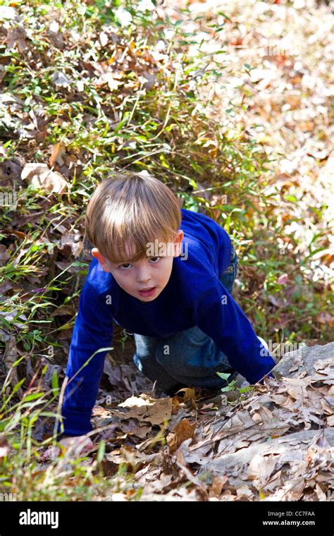 Little Boy Climbing Steep Hill Hi Res Stock Photography And Images Alamy