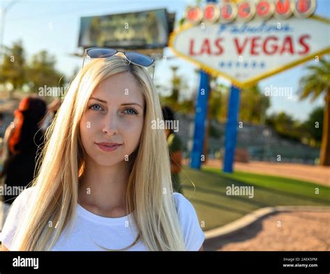 Portrait Of A Gorgeous Blonde Woman On The Las Vegas Strip Standing Under The World Famous