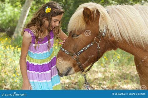 Cute Little Girl Petting Her Pony Stock Photo Image 55492872