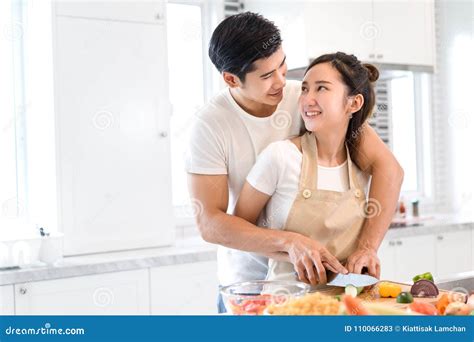Couple Cooking Food In Kitchen Room Young Asian Man And Woman Together Stock Image Image Of