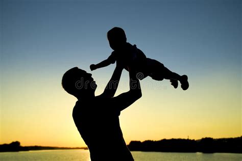 Silhouette Of Father And Son On Sunset Stock Image Image Of Parent