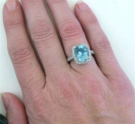 Aquamarine is known as the gem of happiness and youth and is the birthstone for the month of march. 4 carat Fine Quality Aquamarine and Diamond Halo ...