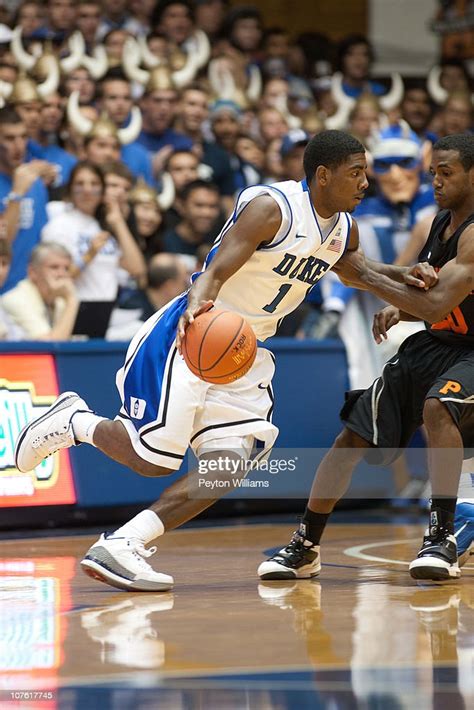 Kyrie Irving Of The Duke Blue Devils Dribbles The Ball While Under