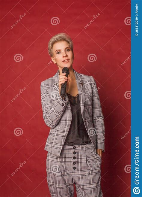Attractive Happy Glamorous Blonde Short Haired Host Singer Blogger Woman In Checked Suit Stock