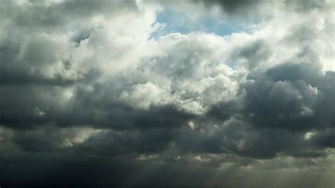 Grey And Ominous Clouds Spotted In The Sky Photo Background And Picture