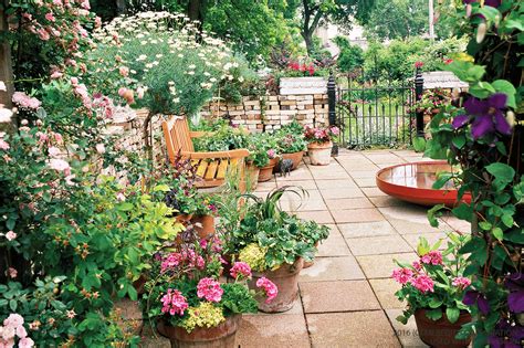 Small garden design with neatly planted flowers and a pathway. How To Maximize Your Small Space For Gardening - The Home ...