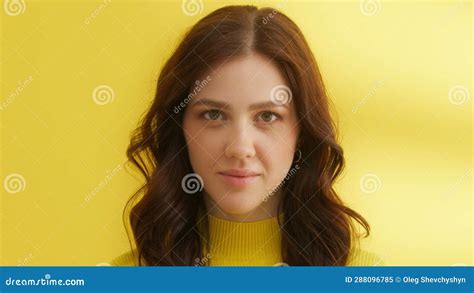 Serious Girl Posing On Camera In Studio Pretty Woman Blinking Eyes